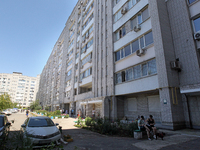 Residents are staying outside an apartment block damaged by the Russian missile attack in Dnipro, Ukraine, on July 8, 2024. NO USE RUSSIA. N...