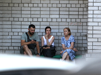 Residents are staying outside an apartment block damaged by the Russian missile attack in Dnipro, Ukraine, on July 8, 2024. NO USE RUSSIA. N...