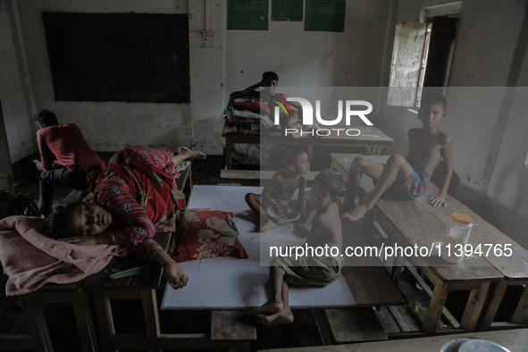 Flood-affected kids are staying at a temporary flood shelter center in Jamalpur, Bangladesh, on July 9, 2024. 