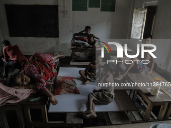 Flood-affected kids are staying at a temporary flood shelter center in Jamalpur, Bangladesh, on July 9, 2024. (