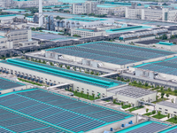 A corner of the rooftop distributed photovoltaic power generation project of Hengli (Nantong) Industrial Park is being shown in Tongzhou dis...