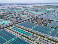 A corner of the rooftop distributed photovoltaic power generation project of Hengli (Nantong) Industrial Park is being shown in Tongzhou dis...