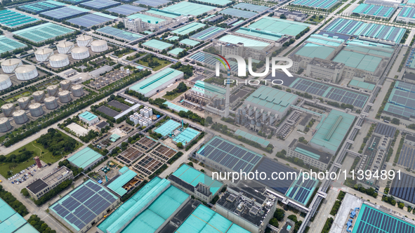 A corner of the rooftop distributed photovoltaic power generation project of Hengli (Nantong) Industrial Park is being shown in Tongzhou dis...