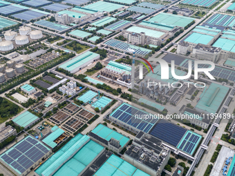 A corner of the rooftop distributed photovoltaic power generation project of Hengli (Nantong) Industrial Park is being shown in Tongzhou dis...