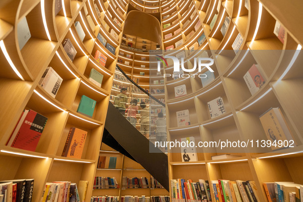 Children are reading at the Book? inside reading space in Hefei, China, on July 9, 2024. 