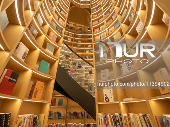 Children are reading at the Book? inside reading space in Hefei, China, on July 9, 2024. (