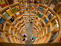 Children are reading at the Book? inside reading space in Hefei, China, on July 9, 2024. (