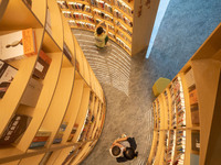 Children are reading at the Book? inside reading space in Hefei, China, on July 9, 2024. (