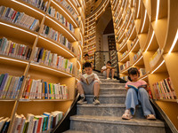 Children are reading at the Book? inside reading space in Hefei, China, on July 9, 2024. (