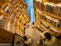 Children are reading at the Book? inside reading space in Hefei, China, on July 9, 2024. (