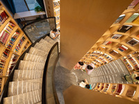 Children are reading at the Book? inside reading space in Hefei, China, on July 9, 2024. (