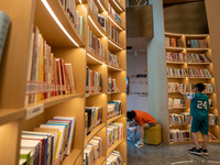 Children are reading at the Book? inside reading space in Hefei, China, on July 9, 2024. (