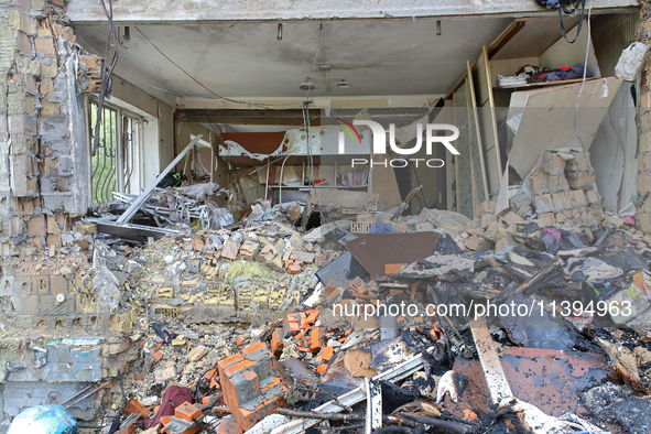 One of the apartments is being pictured at a five-storey residential building in the Holosiivskyi district damaged by the Russian missile at...