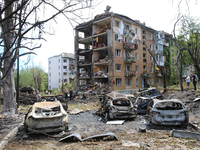 Burnt-out cars are being pictured at a five-storey apartment block in the Holosiivskyi district destroyed by the Russian missile attack in K...