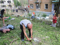 A man is looking for documents outside a five-storey apartment block in the Holosiivskyi district destroyed by the Russian missile attack in...