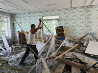 A man is removing the rubble at a kindergarten in the Holosiivskyi district after the Russian missile attack in Kyiv, Ukraine, on July 8, 20...