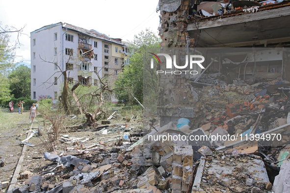 One of the apartments is being pictured at a five-storey residential building in the Holosiivskyi district damaged by the Russian missile at...