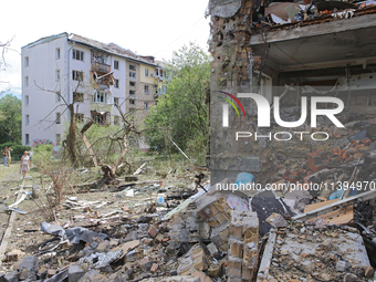 One of the apartments is being pictured at a five-storey residential building in the Holosiivskyi district damaged by the Russian missile at...