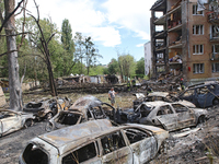 Burnt-out cars are being pictured at a five-storey apartment block in the Holosiivskyi district destroyed by the Russian missile attack in K...