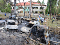 Burnt-out cars are being pictured at a kindergarten in the Holosiivskyi district destroyed by the Russian missile attack in Kyiv, Ukraine, o...