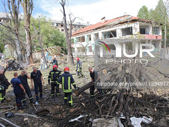 Rescuers are working near a kindergarten in the Holosiivskyi district destroyed by the Russian missile attack in Kyiv, Ukraine, on July 8, 2...