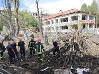 Rescuers are working near a kindergarten in the Holosiivskyi district destroyed by the Russian missile attack in Kyiv, Ukraine, on July 8, 2...