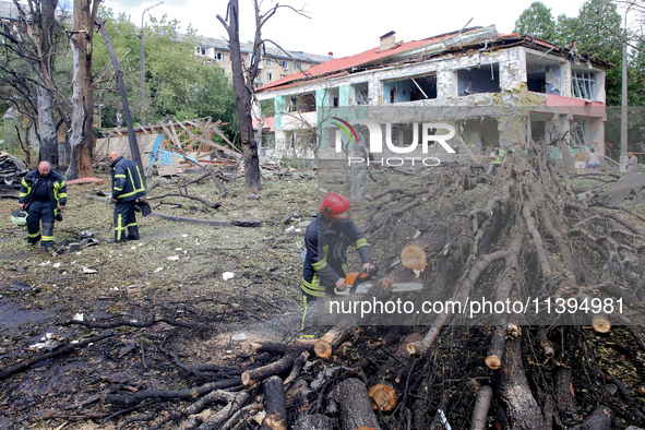 Rescuers are working near a kindergarten in the Holosiivskyi district destroyed by the Russian missile attack in Kyiv, Ukraine, on July 8, 2...