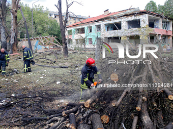 Rescuers are working near a kindergarten in the Holosiivskyi district destroyed by the Russian missile attack in Kyiv, Ukraine, on July 8, 2...