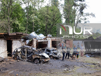 Garages in the Holosiivskyi district are being destroyed by the Russian missile attack in Kyiv, Ukraine, on July 8, 2024. NO USE RUSSIA. NO...