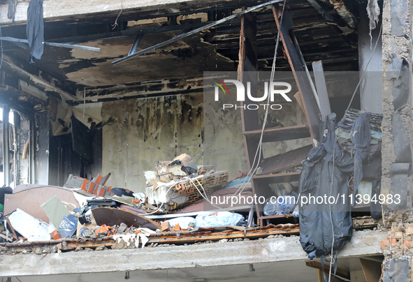 One of the apartments is being pictured at a five-storey residential building in the Holosiivskyi district damaged by the Russian missile at...