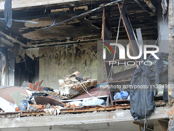 One of the apartments is being pictured at a five-storey residential building in the Holosiivskyi district damaged by the Russian missile at...