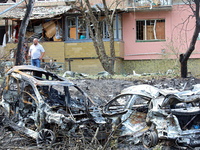 Burnt-out cars are being pictured at a five-storey apartment block in the Holosiivskyi district destroyed by the Russian missile attack in K...