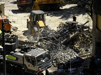 Rescuers are continuing to work at the Okhmatdyt children's hospital, which is heavily damaged by a Russian missile strike in Kyiv, Ukraine,...