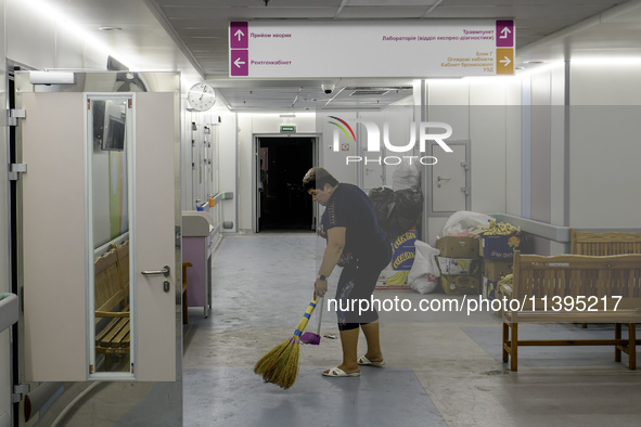 Staff are cleaning the premises of the Ohmatdyt Children's Hospital that was strongly damaged during a Russian missile strike in Kyiv, Ukrai...