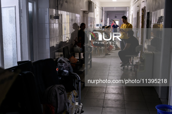 Staff are cleaning the premises of the Ohmatdyt Children's Hospital that was strongly damaged during a Russian missile strike in Kyiv, Ukrai...