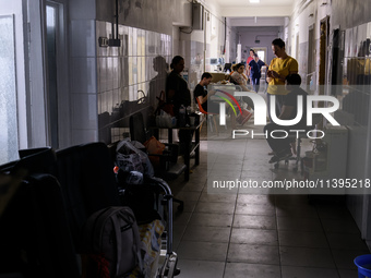 Staff are cleaning the premises of the Ohmatdyt Children's Hospital that was strongly damaged during a Russian missile strike in Kyiv, Ukrai...