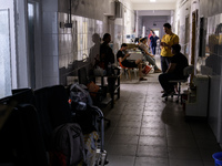 Staff are cleaning the premises of the Ohmatdyt Children's Hospital that was strongly damaged during a Russian missile strike in Kyiv, Ukrai...