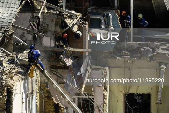 Rescuers are continuing to work at the Okhmatdyt children's hospital, which is heavily damaged by a Russian missile strike in Kyiv, Ukraine,...