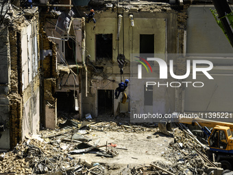 Rescuers are continuing to work at the Okhmatdyt children's hospital, which is heavily damaged by a Russian missile strike in Kyiv, Ukraine,...