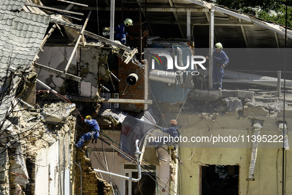 Rescuers are continuing to work at the Okhmatdyt children's hospital, which is heavily damaged by a Russian missile strike in Kyiv, Ukraine,...