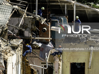 Rescuers are continuing to work at the Okhmatdyt children's hospital, which is heavily damaged by a Russian missile strike in Kyiv, Ukraine,...