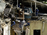 Rescuers are continuing to work at the Okhmatdyt children's hospital, which is heavily damaged by a Russian missile strike in Kyiv, Ukraine,...