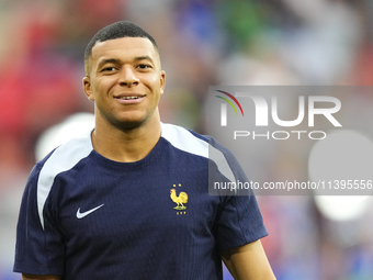 Kylian Mbappe centre-forward of France and Real Madrid during the warm-up before  the UEFA EURO 2024 semi-final match between Spain v France...