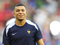 Kylian Mbappe centre-forward of France and Real Madrid during the warm-up before  the UEFA EURO 2024 semi-final match between Spain v France...