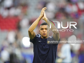 Kylian Mbappe centre-forward of France and Real Madrid during the warm-up before  the UEFA EURO 2024 semi-final match between Spain v France...