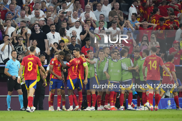 Lamine Yamal right winger of Spain and FC Barcelona celebrates after scoring his sides first goal during the UEFA EURO 2024 semi-final match...