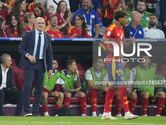 Miguel de la Fuente head coach of Spain congratulations to Lamine Yamal right winger of Spain and FC Barcelona during the UEFA EURO 2024 sem...