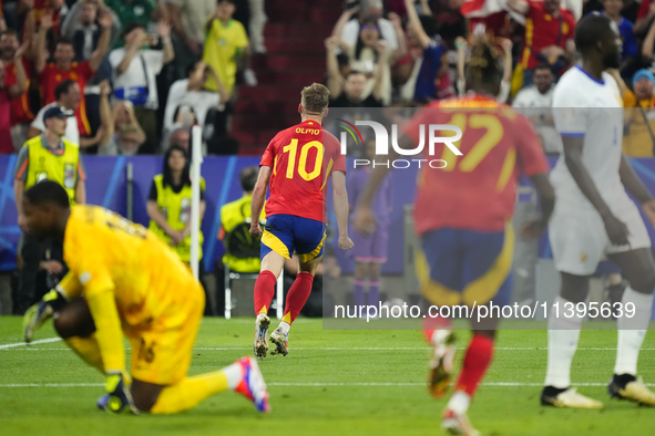 Dani Olmo attacking midfield of Spain and RB Leipzig celebrates after scoring his sides first goal during the UEFA EURO 2024 semi-final matc...