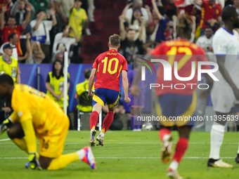 Dani Olmo attacking midfield of Spain and RB Leipzig celebrates after scoring his sides first goal during the UEFA EURO 2024 semi-final matc...