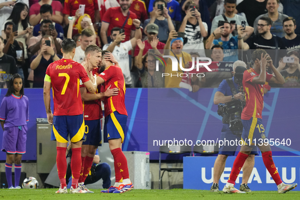 Dani Olmo attacking midfield of Spain and RB Leipzig celebrates after scoring his sides first goal during the UEFA EURO 2024 semi-final matc...